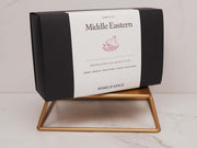 a black and white box sitting on top of a wooden stand