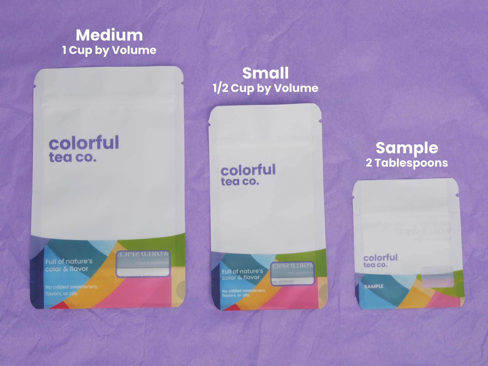 three bags of colorful tea on a purple background