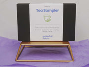 a box of tea sitting on top of a wooden stand